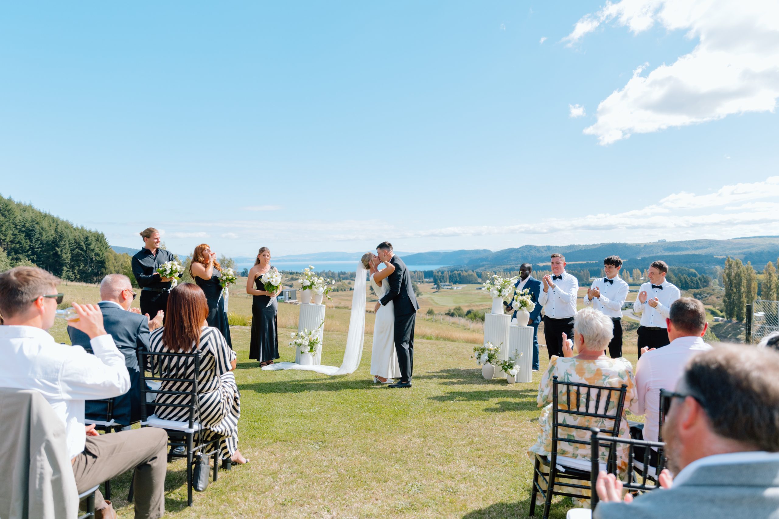 Wedding ceremony on the lawn overlooking Lake Taupō